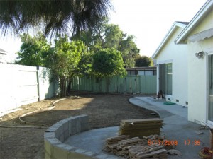 Defining the contour of the lawn, and building up the wall.